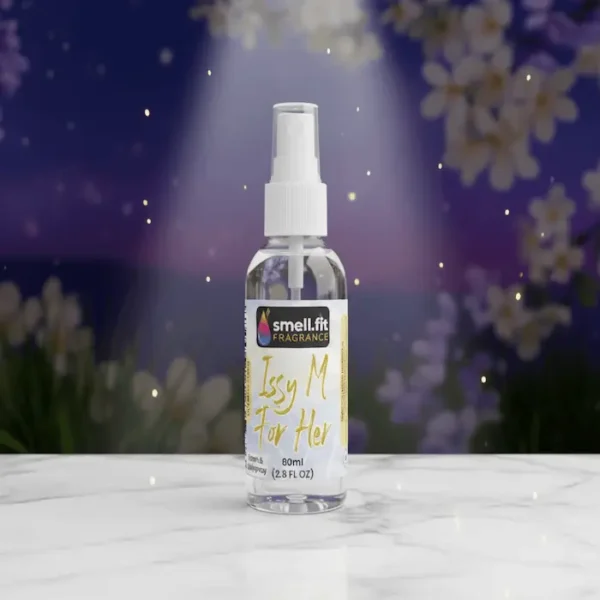 Issy M For Her - Inspired by L'Eau d'Issey Product image of Smell.fit Fragrance 'Issy M For Her Room & Bodyspray' 80ml (2.8 FL OZ) mist spray bottle. The bottle is sitting on a white marble surface, illuminated by a spotlight, against a dark purple or nighttime background featuring soft-focus white flowers and sparkling lights.