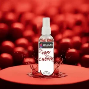 Product image of Smell.fit Fragrance 'Very Cherry' 80ml (2.8 FL OZ) mist spray bottle. The bottle is standing in a splash of red liquid on a red pedestal, against a dramatic, blurred background filled with deep red cherries.